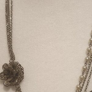 Asymmetrical silver necklace.